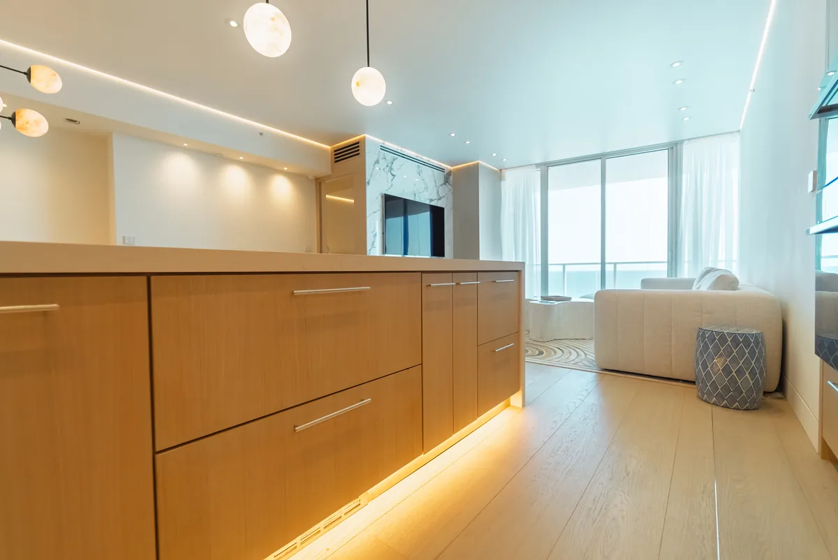 Kitchen island and wood cabinetry with under-lighting, Continuum South Tower, Miami Beach