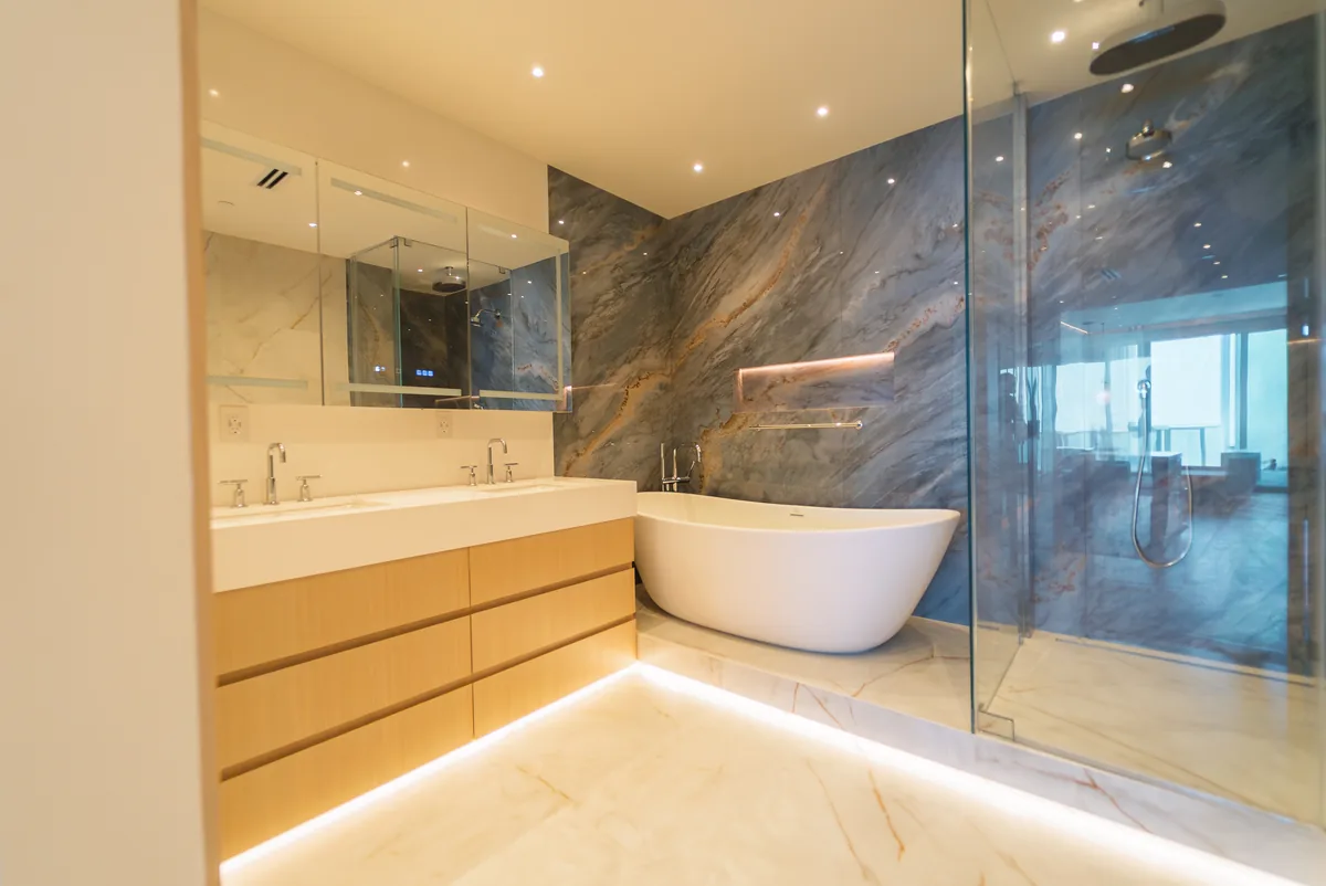 Primary bath with a blue marble wall and freestanding tub, Continuum South Tower, Miami Beach