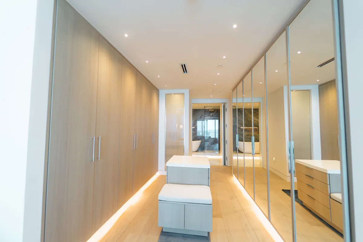 Walk-in closet with lit millwork, Continuum South Tower, Miami Beach